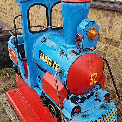 Coin operated ride - coin, train